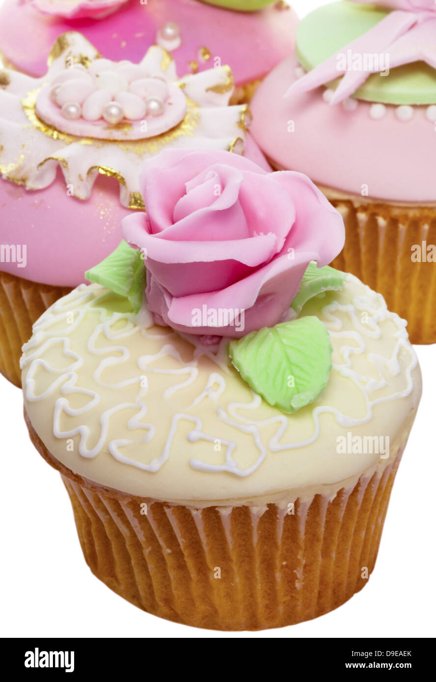 Iced tortine in rosa, bianco, blu e oro. Foto Stock