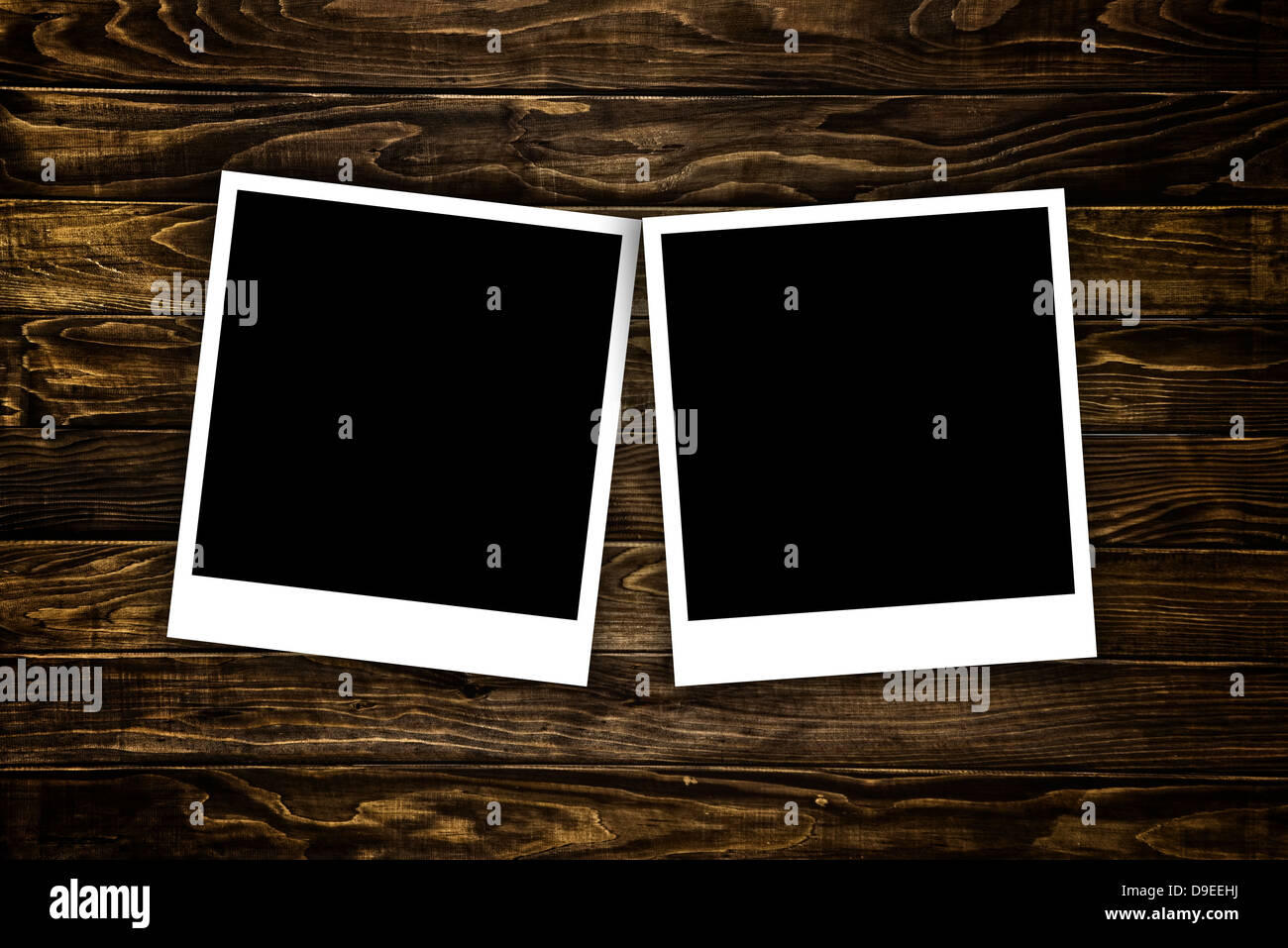 Blank Foto fotogrammi su un sfondo di legno Foto Stock