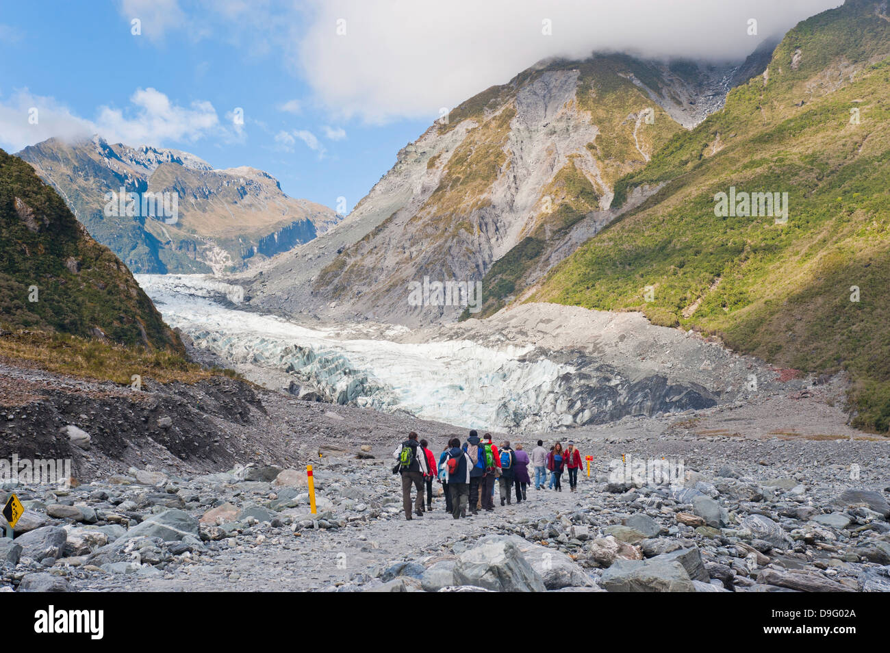 I turisti su Fox Glacier tour, Westland National Park, sito Patrimonio Mondiale dell'UNESCO, Isola del Sud, Nuova Zelanda Foto Stock