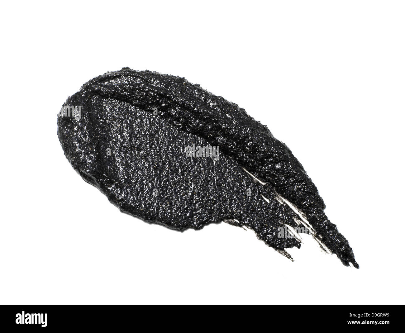 Crema nero ombretto cospargere ritagliato su uno sfondo bianco Foto Stock