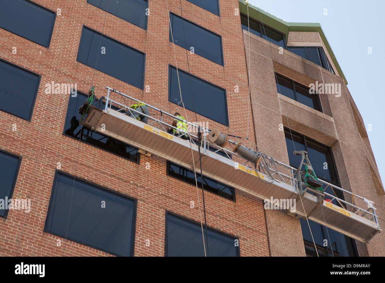 Uomini al lavoro su areale e piattaforma di lavoro - USA Foto Stock