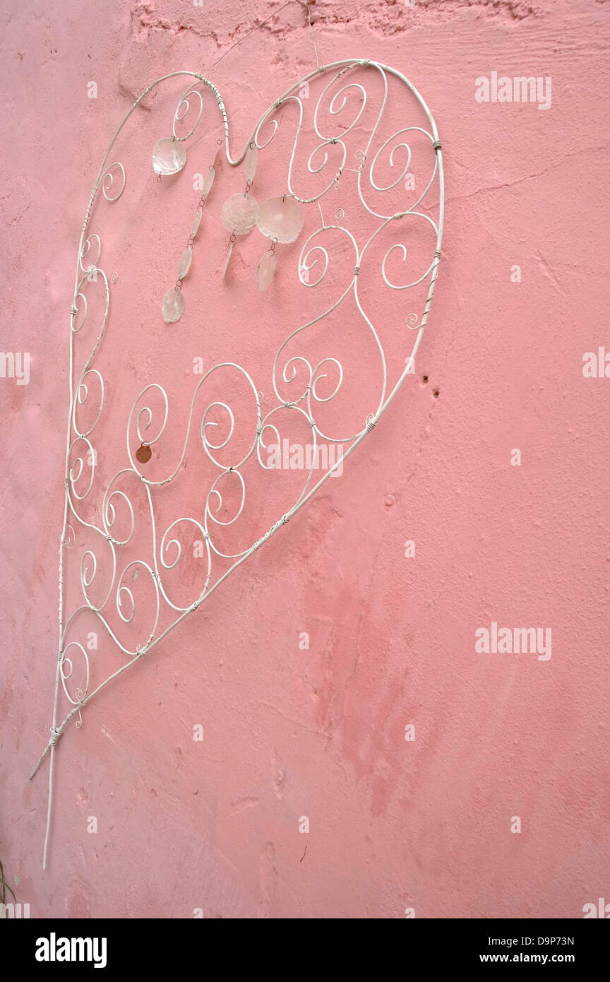 Cuore ornati a parete rosa Foto Stock