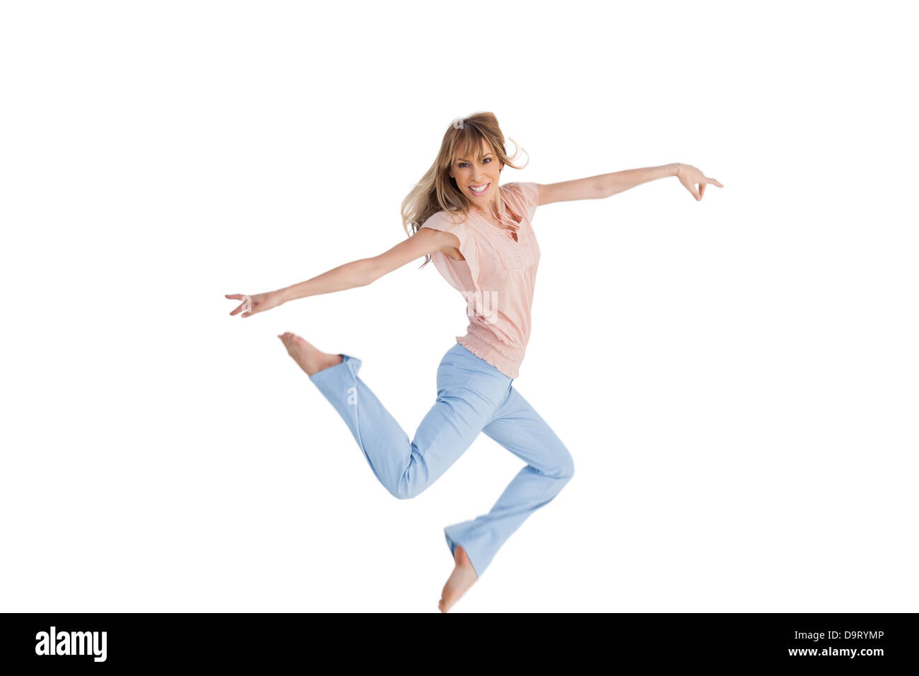 Donna graziosa jumping Foto Stock