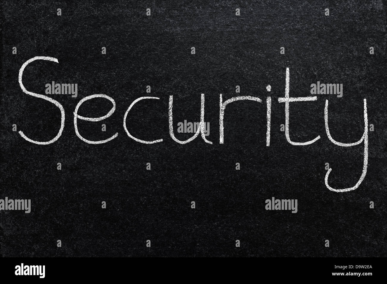Sicurezza scritta in gesso bianco su una lavagna. Foto Stock