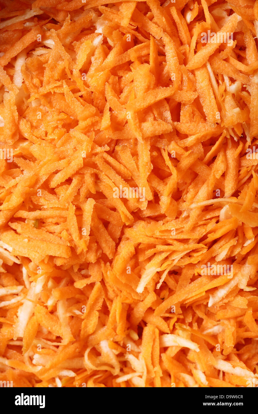 Close up di carote grattugiate insalata di verdure come sfondo Foto Stock