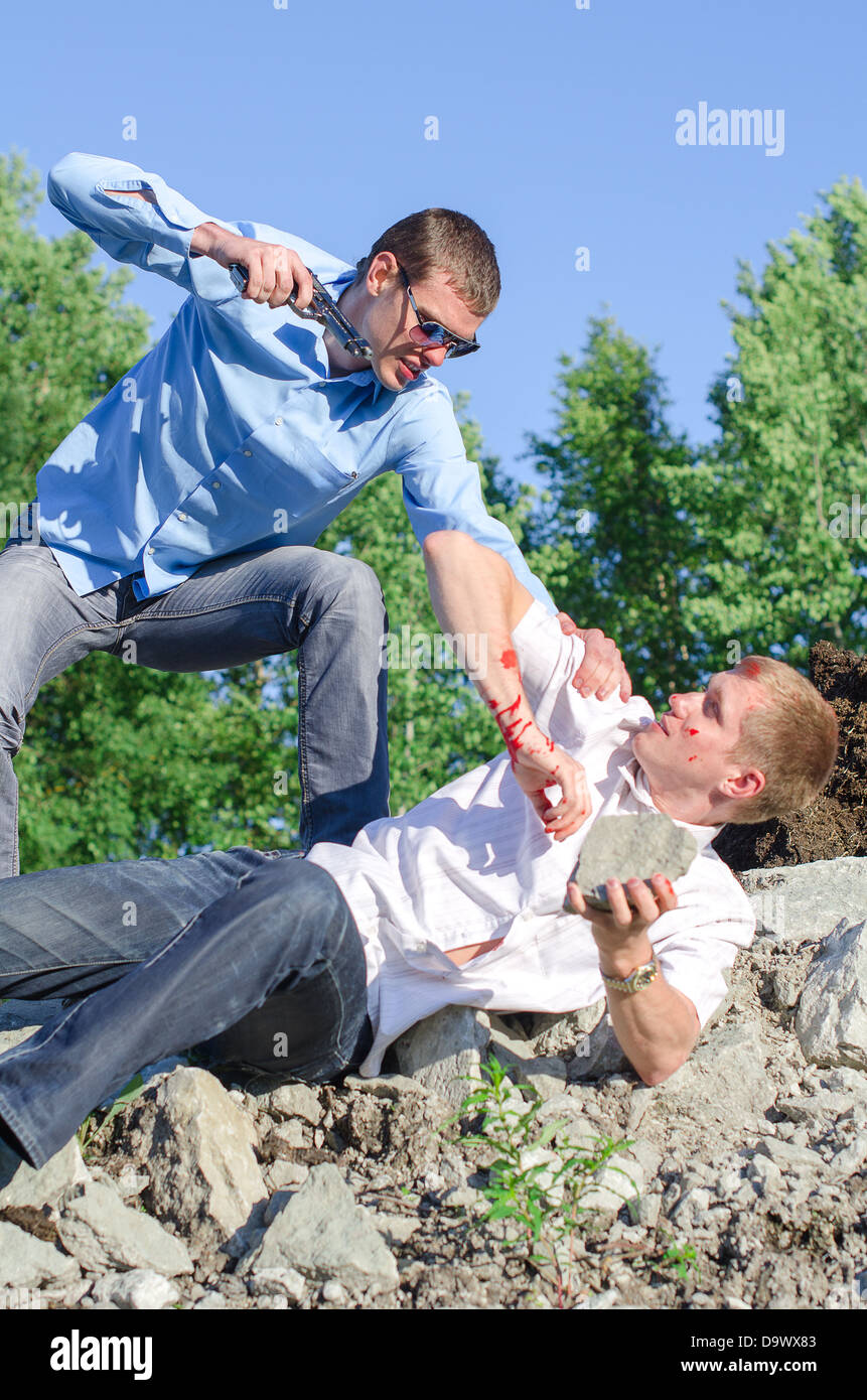 Minaccia criminale con una pistola Foto Stock