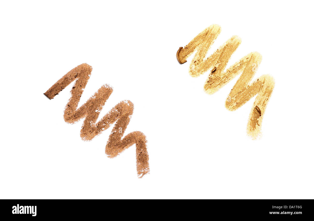 Oro eyeliner scarabocchio ritagliato su uno sfondo bianco Foto Stock