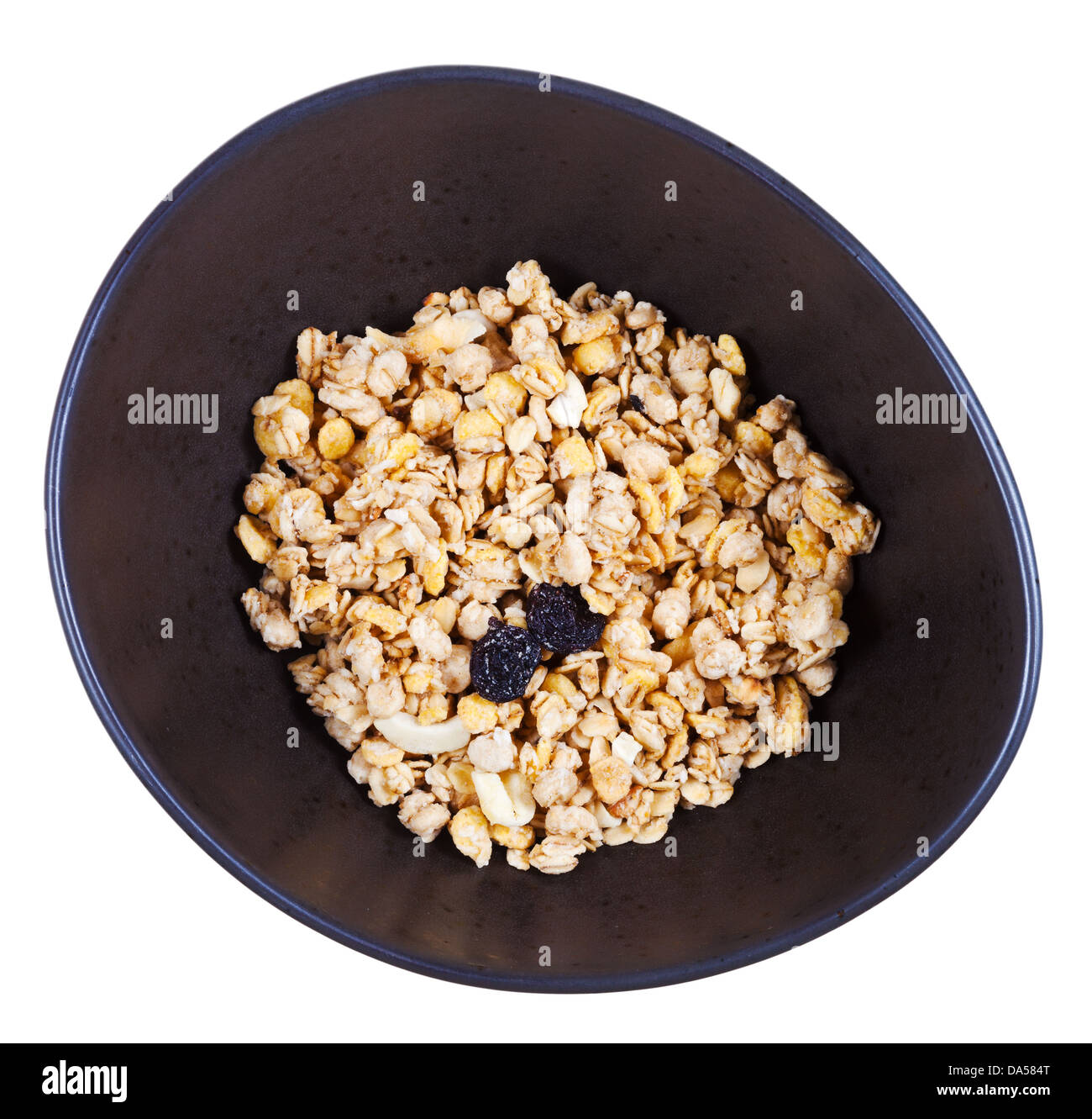 Vista superiore della secca muesli con uvetta e i dadi in vaso nero Foto Stock