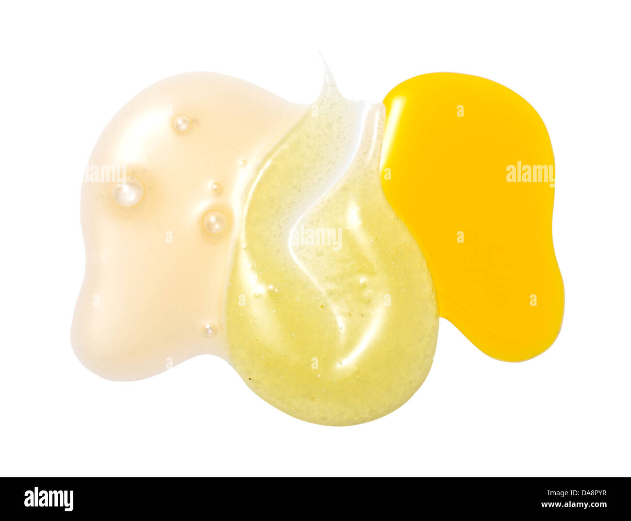 Giallo arancione crema gel olio tagliare su sfondo bianco Foto Stock