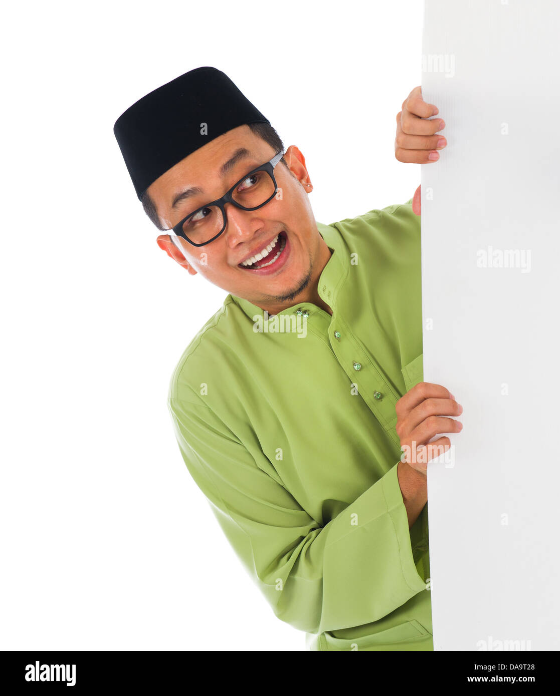 Maschio malay con la scheda vuota durante la hari raya Eid al-Fitr celebrazione Foto Stock