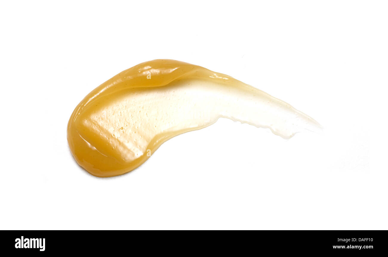 Giallo arancione crema gel olio tagliare su sfondo bianco Foto Stock