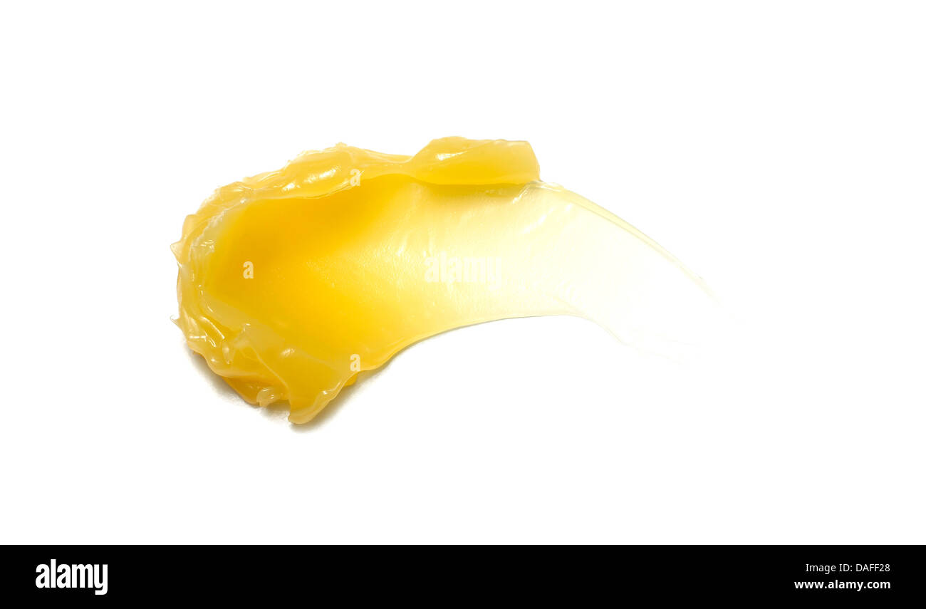 Giallo arancione crema gel olio tagliare su sfondo bianco Foto Stock