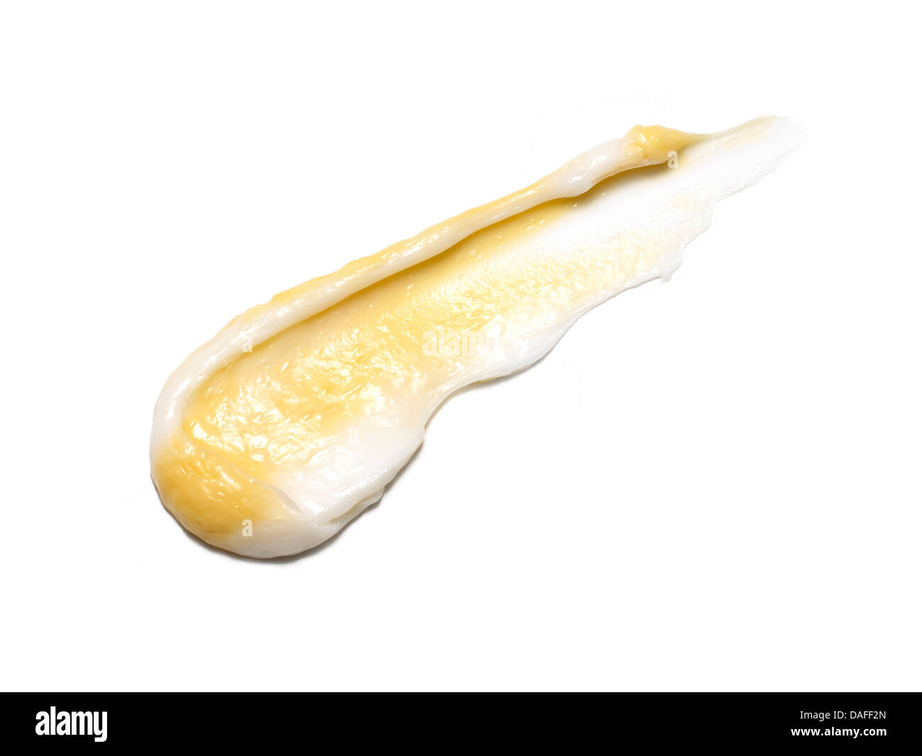 Giallo arancione crema gel olio tagliare su sfondo bianco Foto Stock