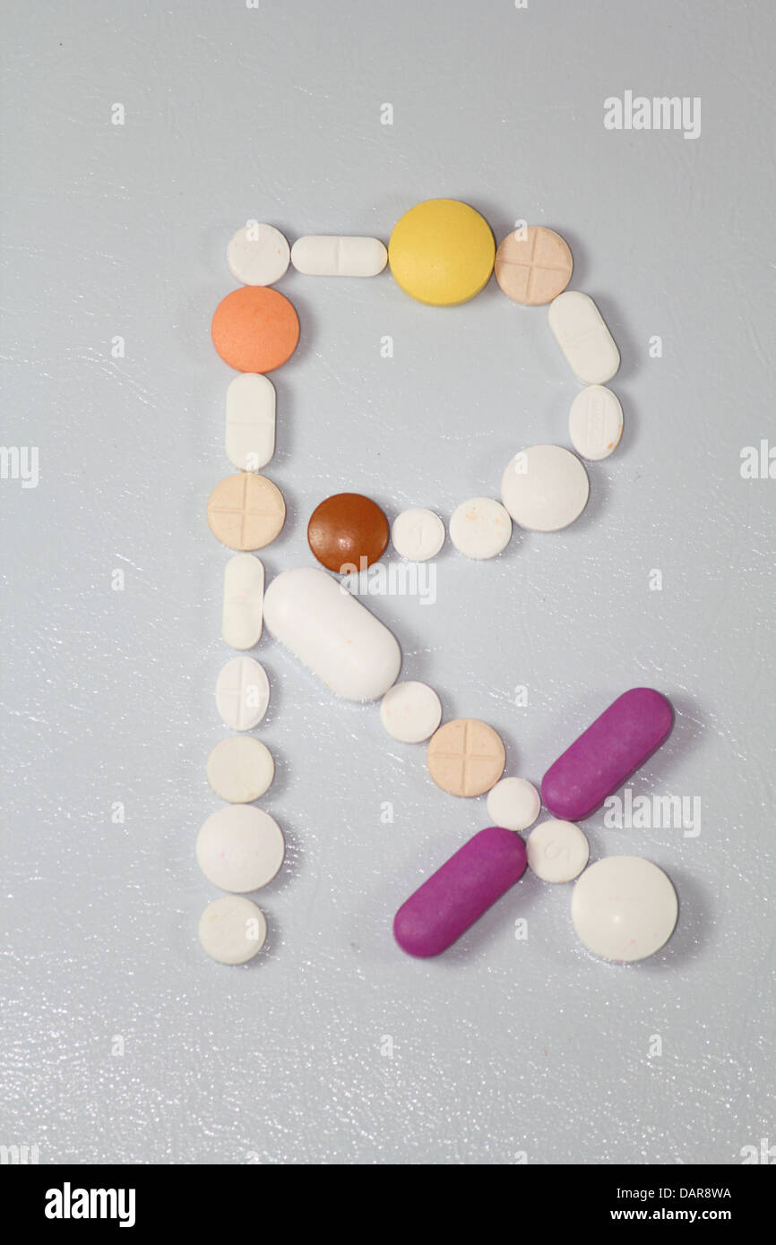 Pills disposti in Rx Simbolo Foto Stock