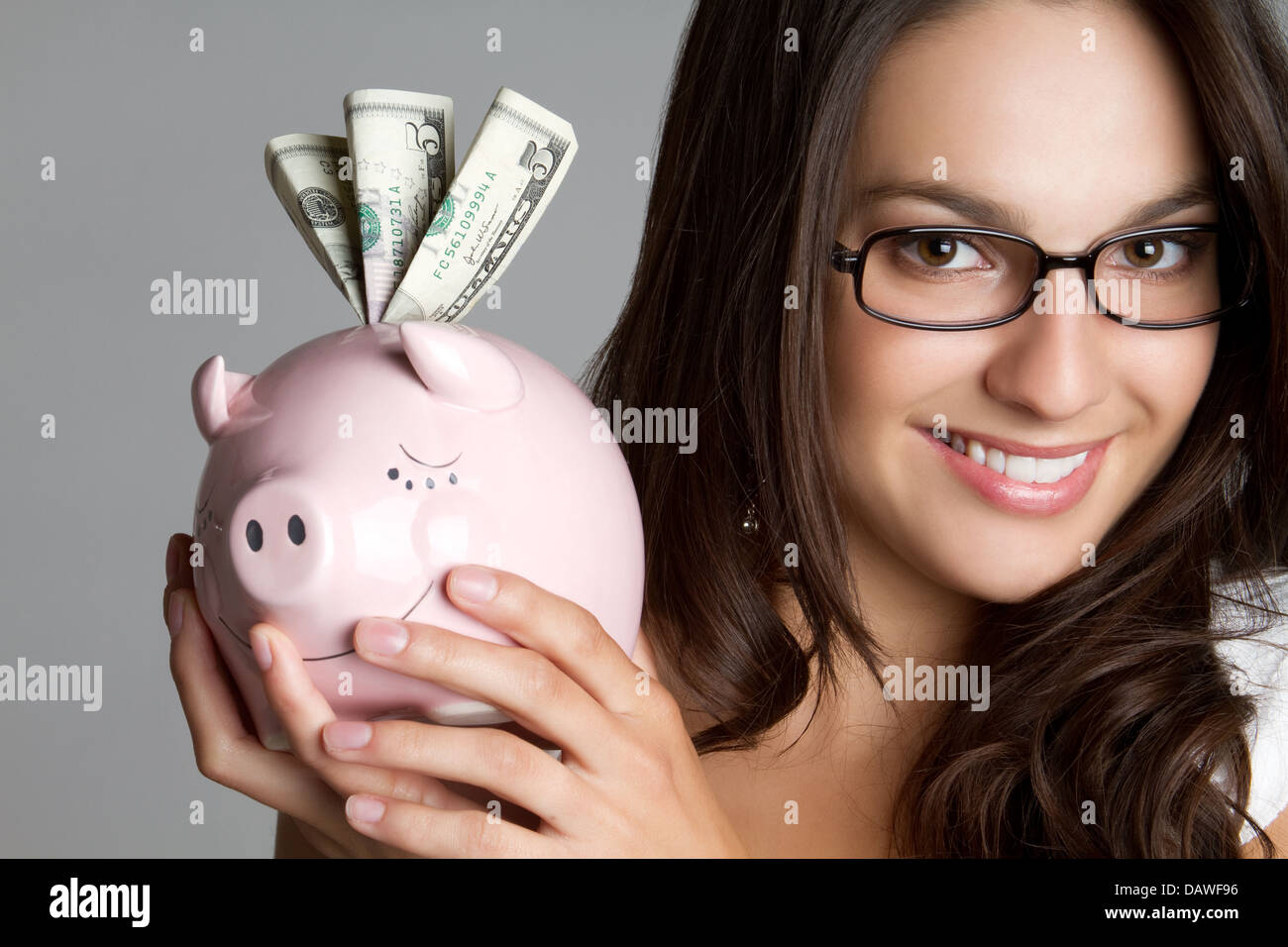 Ragazza con Salvadanaio Foto Stock