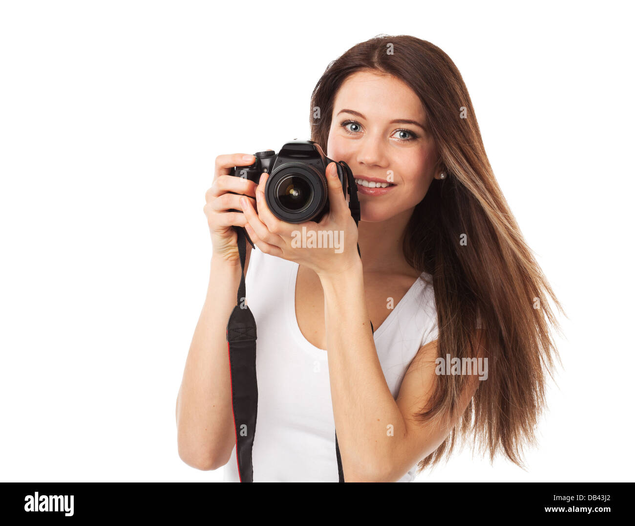 Un allegro giovane donna con fotocamera digitale, isolato su bianco Foto Stock