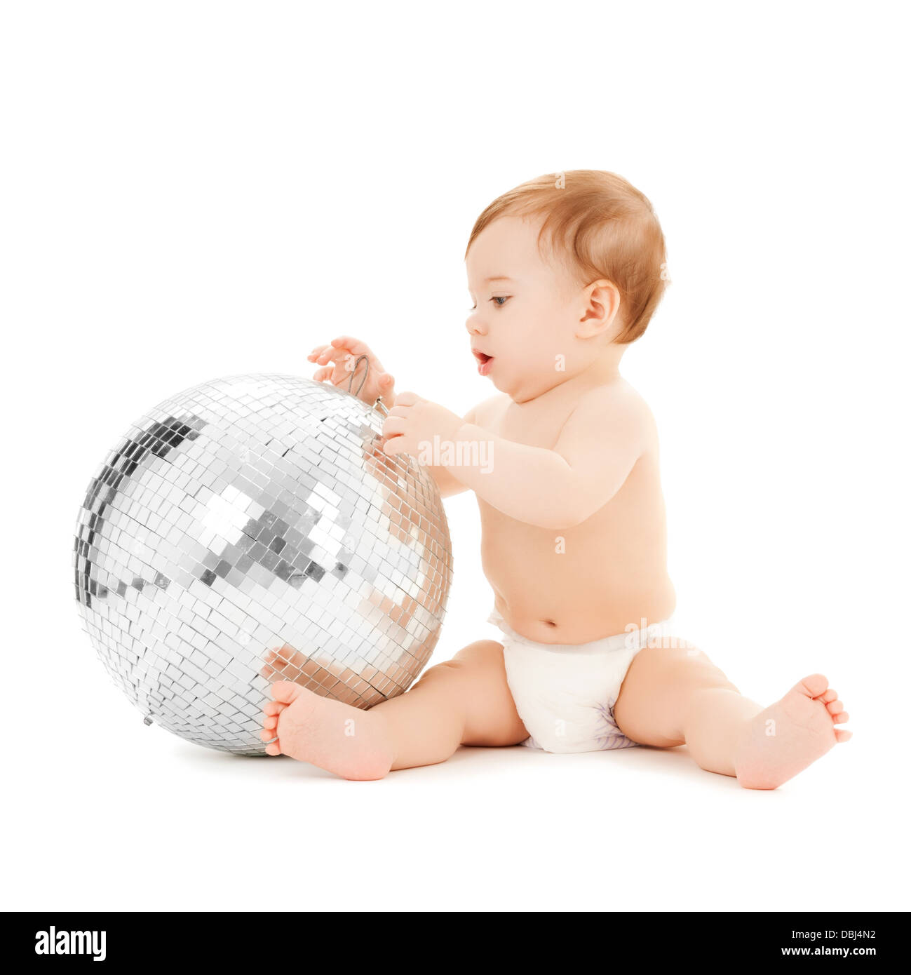 Bambino che gioca con la palla da discoteca Foto Stock