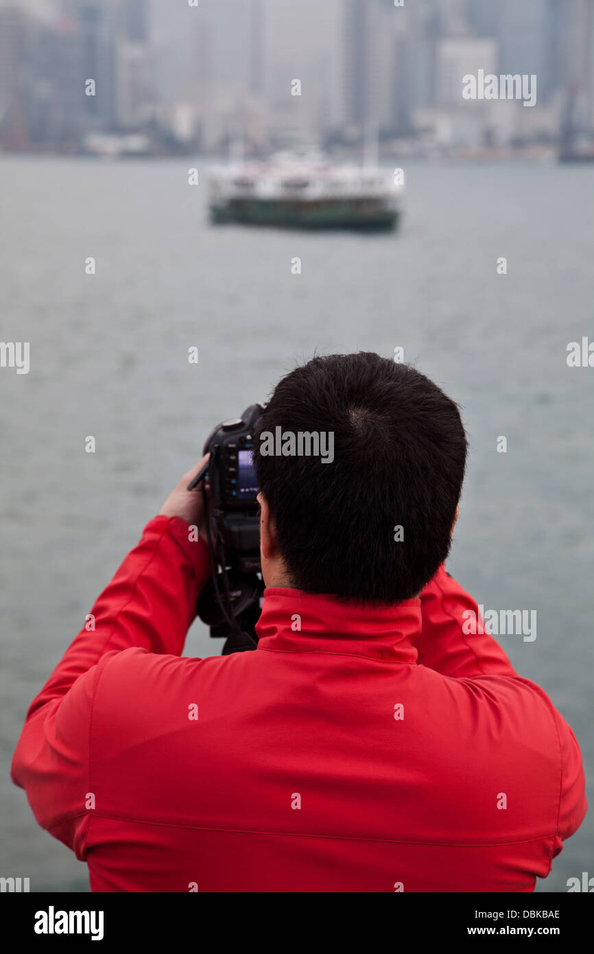 Porto di Hong Kong skyline scena turisti turismo Foto Stock