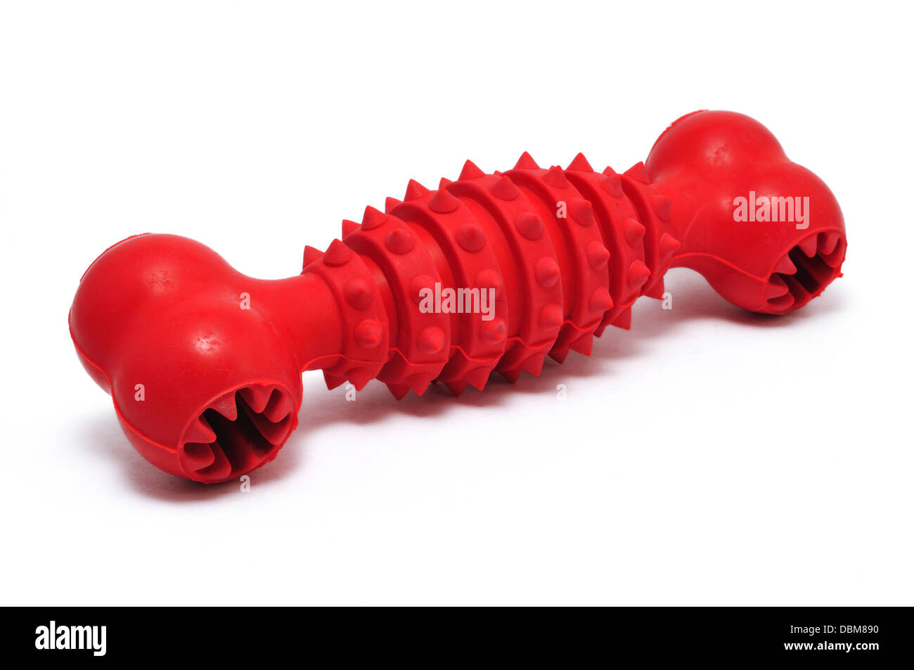 Gomma rosso prodotto da masticare per cani Toy isolato su bianco. Foto Stock