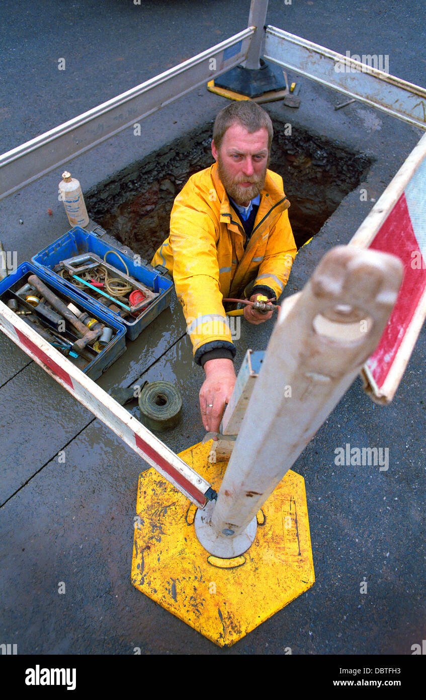 Ingegnere di gas lavorando in strada. Foto Stock