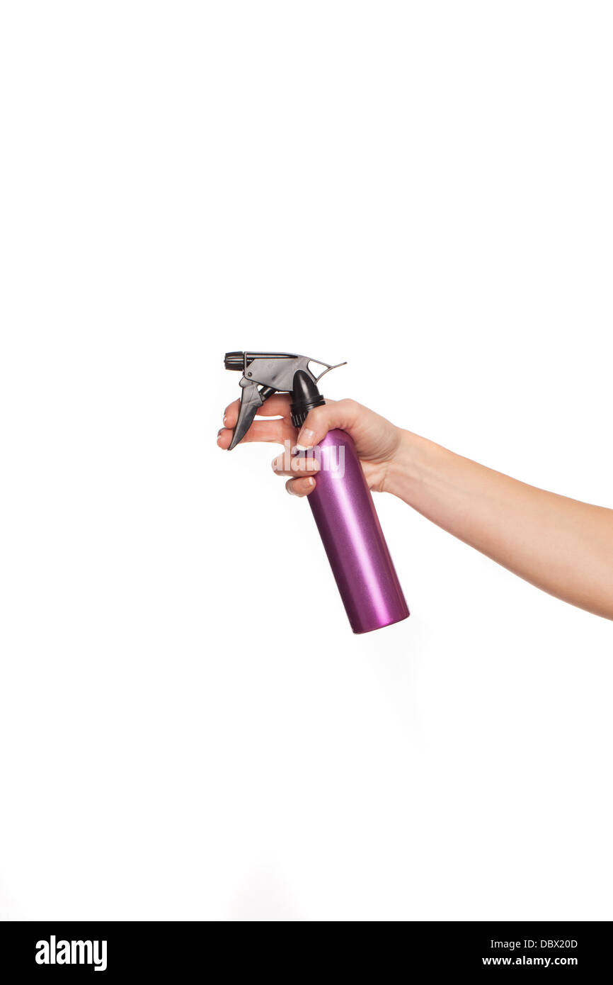 Femmina lato tenendo una bomboletta spray Foto Stock