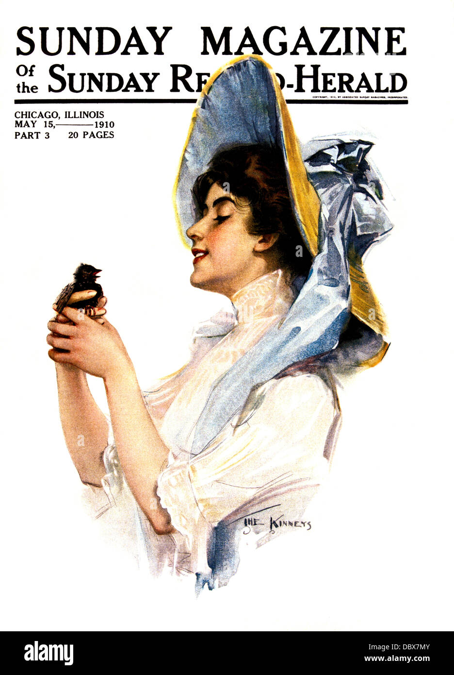 1900s 1910s donna sorridente indossando HAT legata con grande arco BLU HOLDING BIRD 15 maggio 1910 SUNDAY MAGAZINE COVER Foto Stock