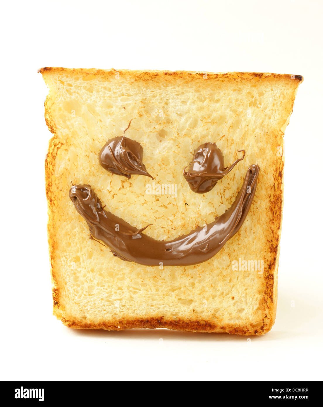 Funny pane tostato con sorriso di cioccolato su sfondo bianco Foto Stock