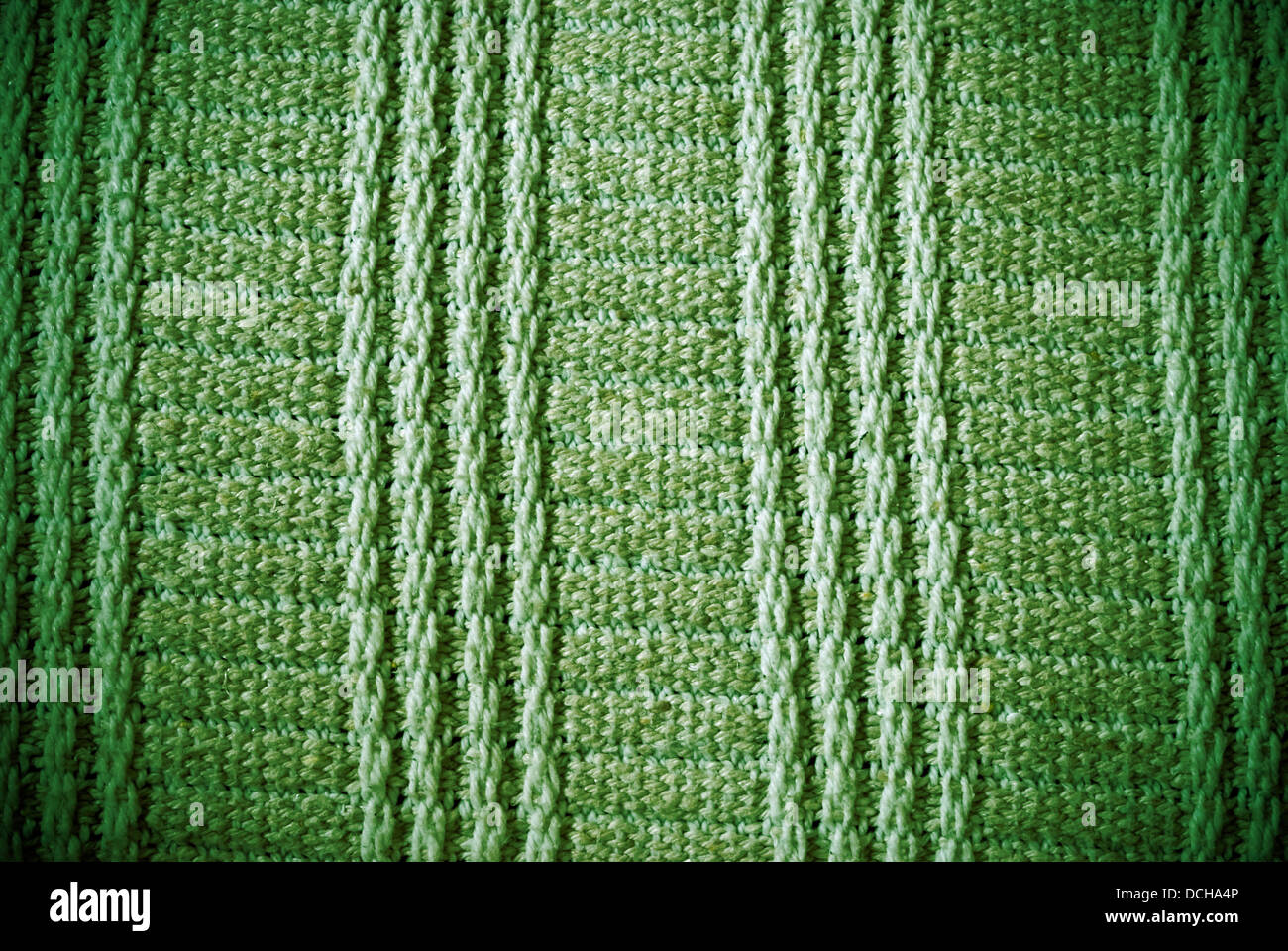 Erba verde a strisce regolari e il materiale tessuto di sfondo o la texture Foto Stock