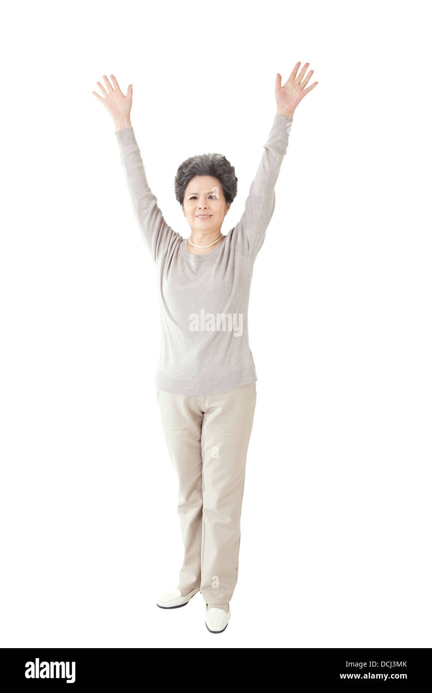 Il vecchio donna fino le braccia Foto Stock