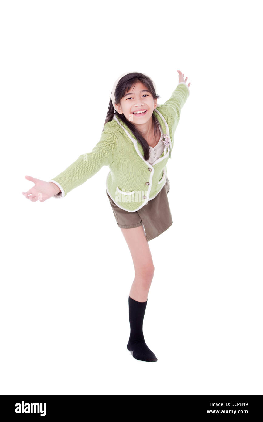 La ragazza nel maglione verde sporgendoti in benvenuti Foto Stock