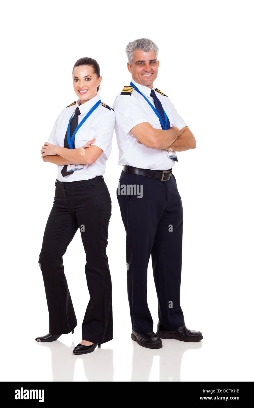 Senior pilota femmina e il co-pilota a piena lunghezza ritratto su bianco Foto Stock