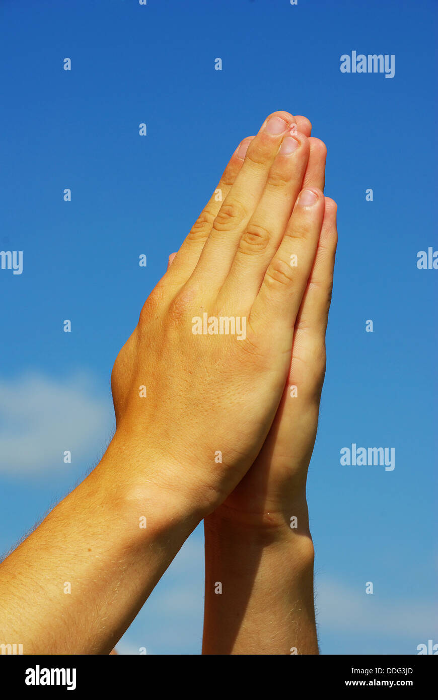 mani nella preghiera Foto Stock