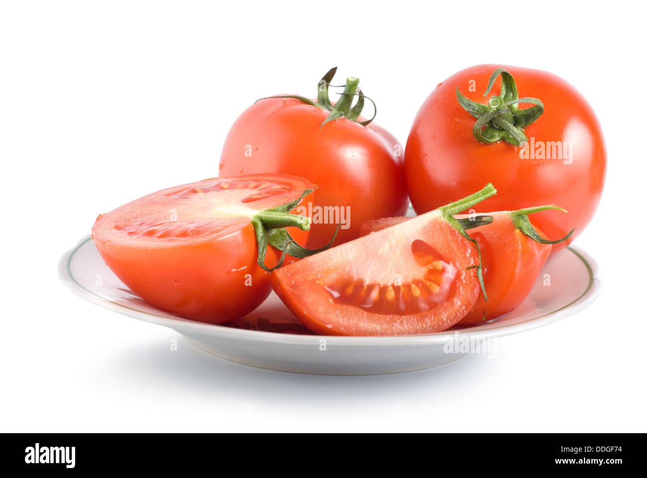 I pomodori su una piastra Foto Stock