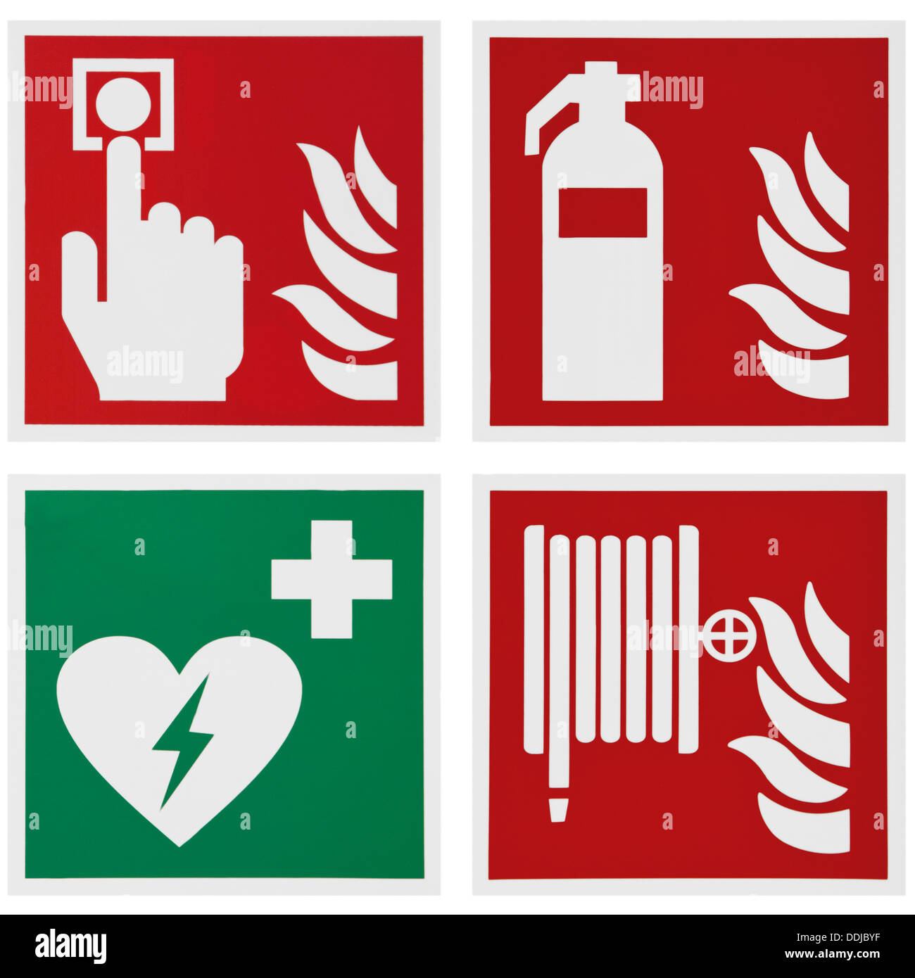 Segni di allarme antincendio e defibrillatore contro uno sfondo bianco, close up Foto Stock