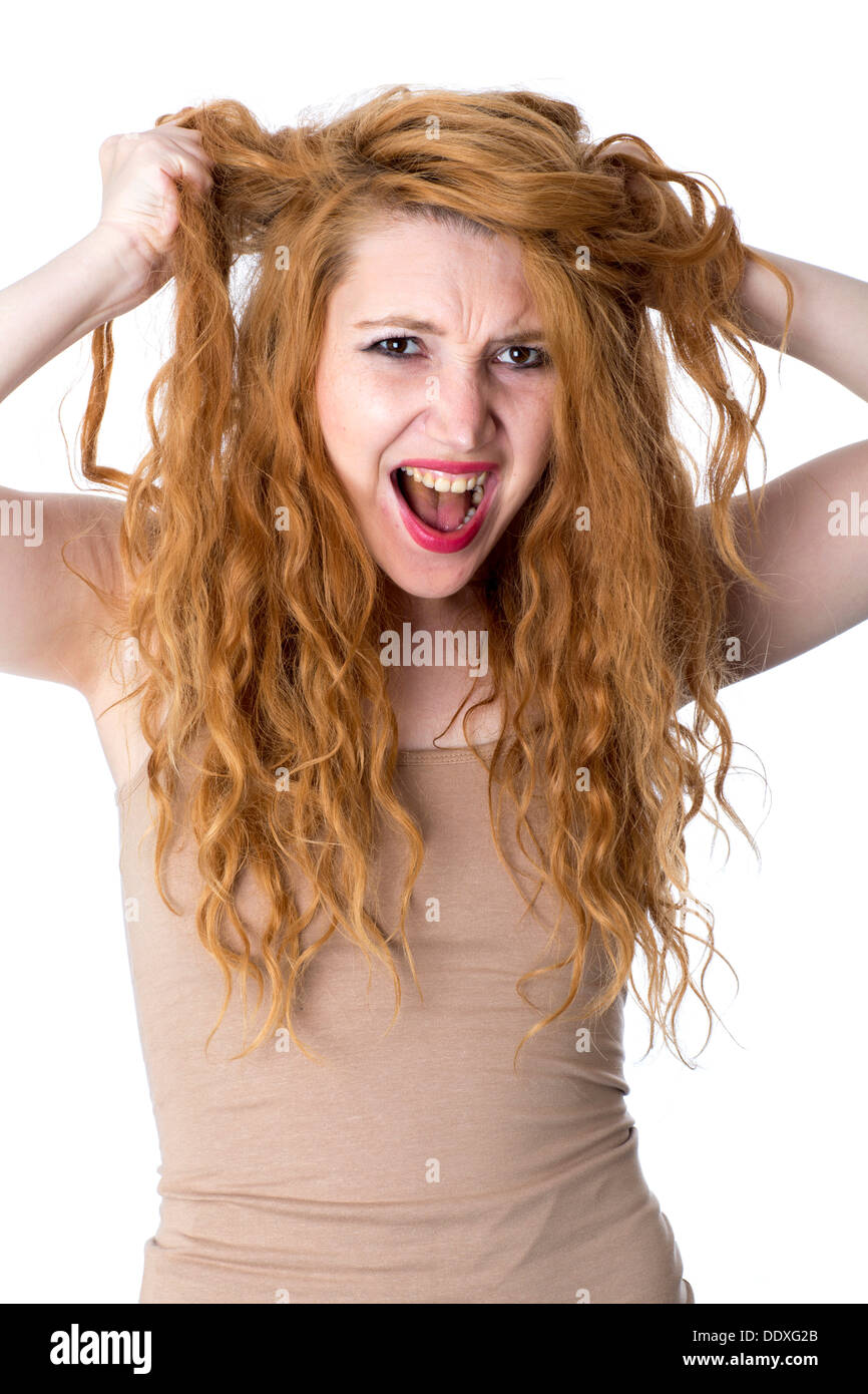 Modello rilasciato. arrabbiato giovane donna strappo capelli fuori Foto Stock