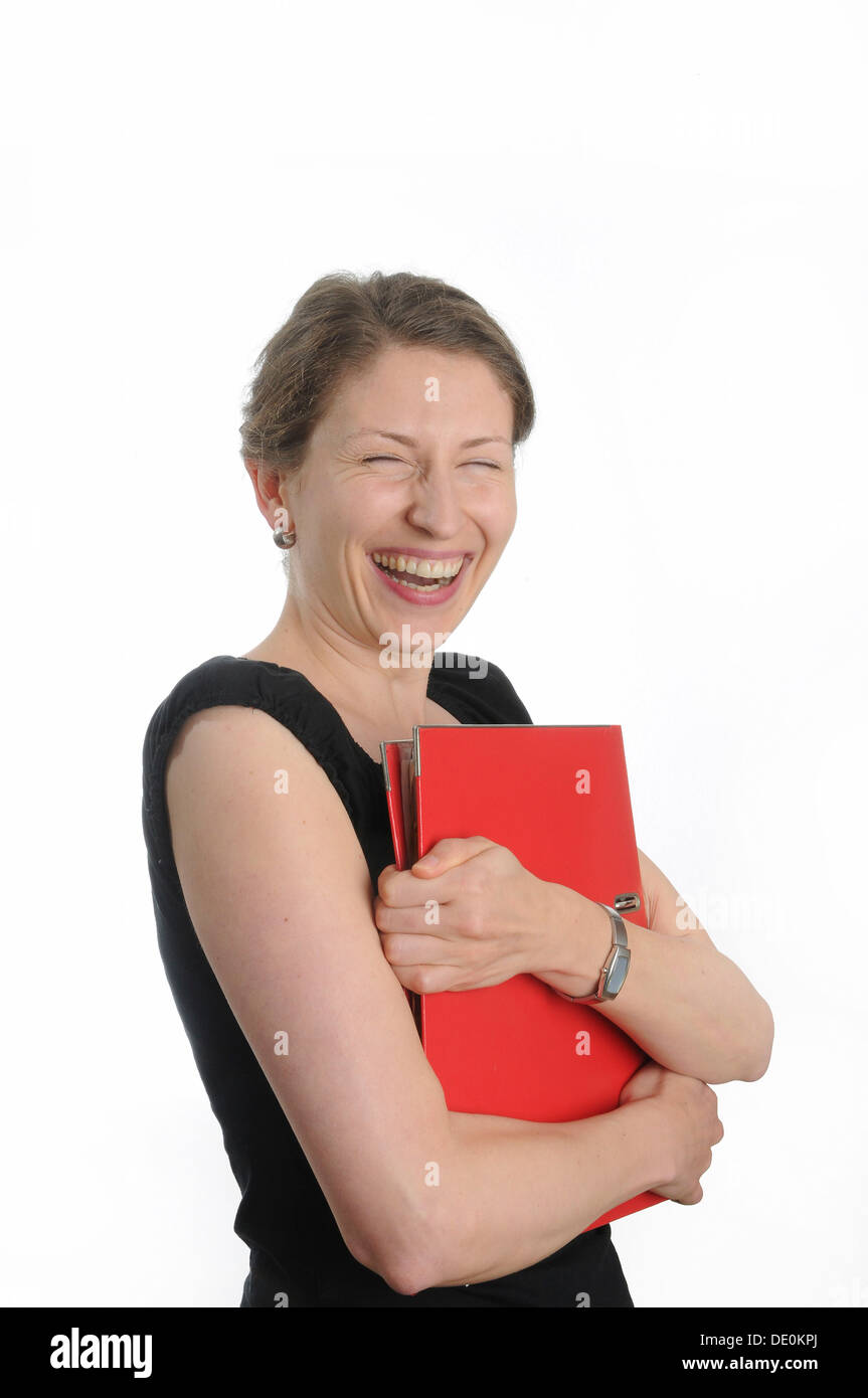 Giovane donna in possesso di una cartella rossa Foto Stock