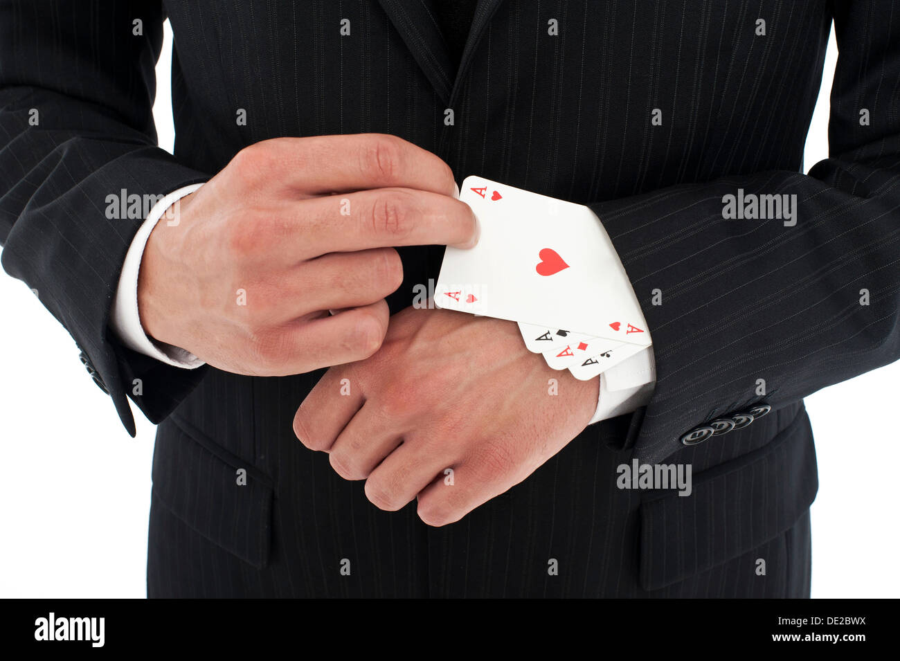 L uomo indossa una tuta tirando diverse aces al di fuori della sua manica Foto Stock