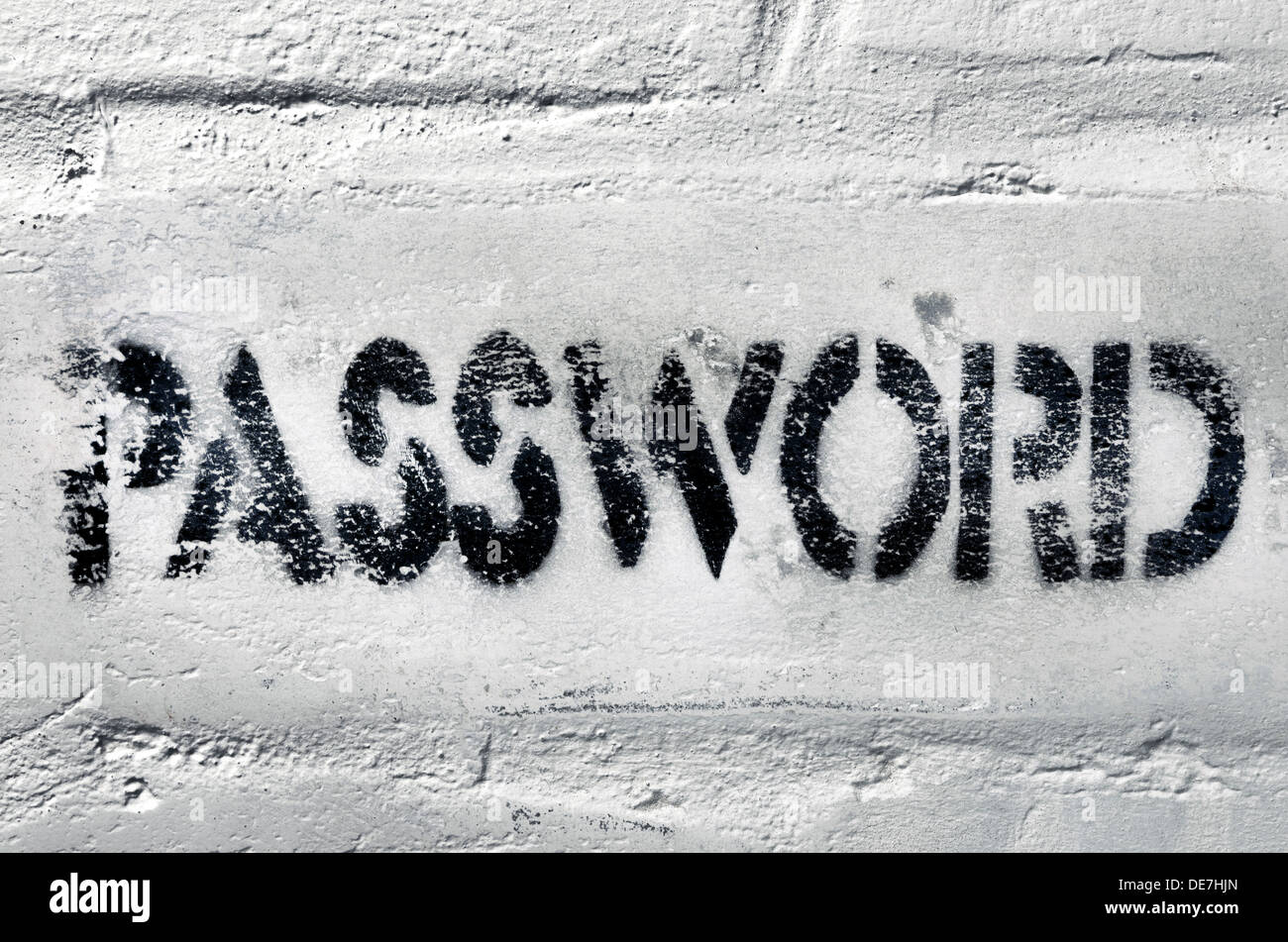 Nero testurizzato stampa serigrafica di domanda per password sul weathered bianco muro di mattoni Foto Stock