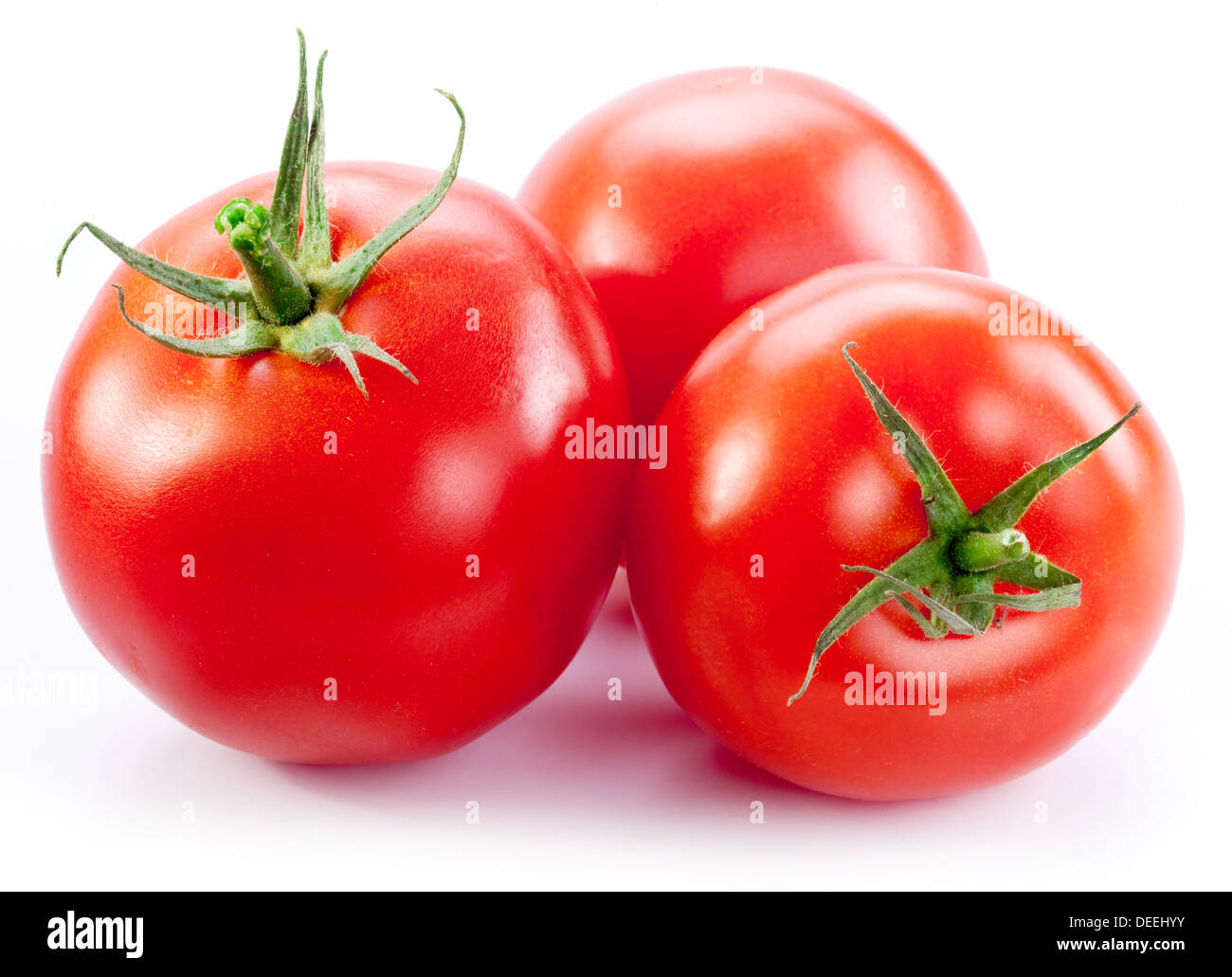 Mature pomodori rossi isolato su uno sfondo bianco. Foto Stock