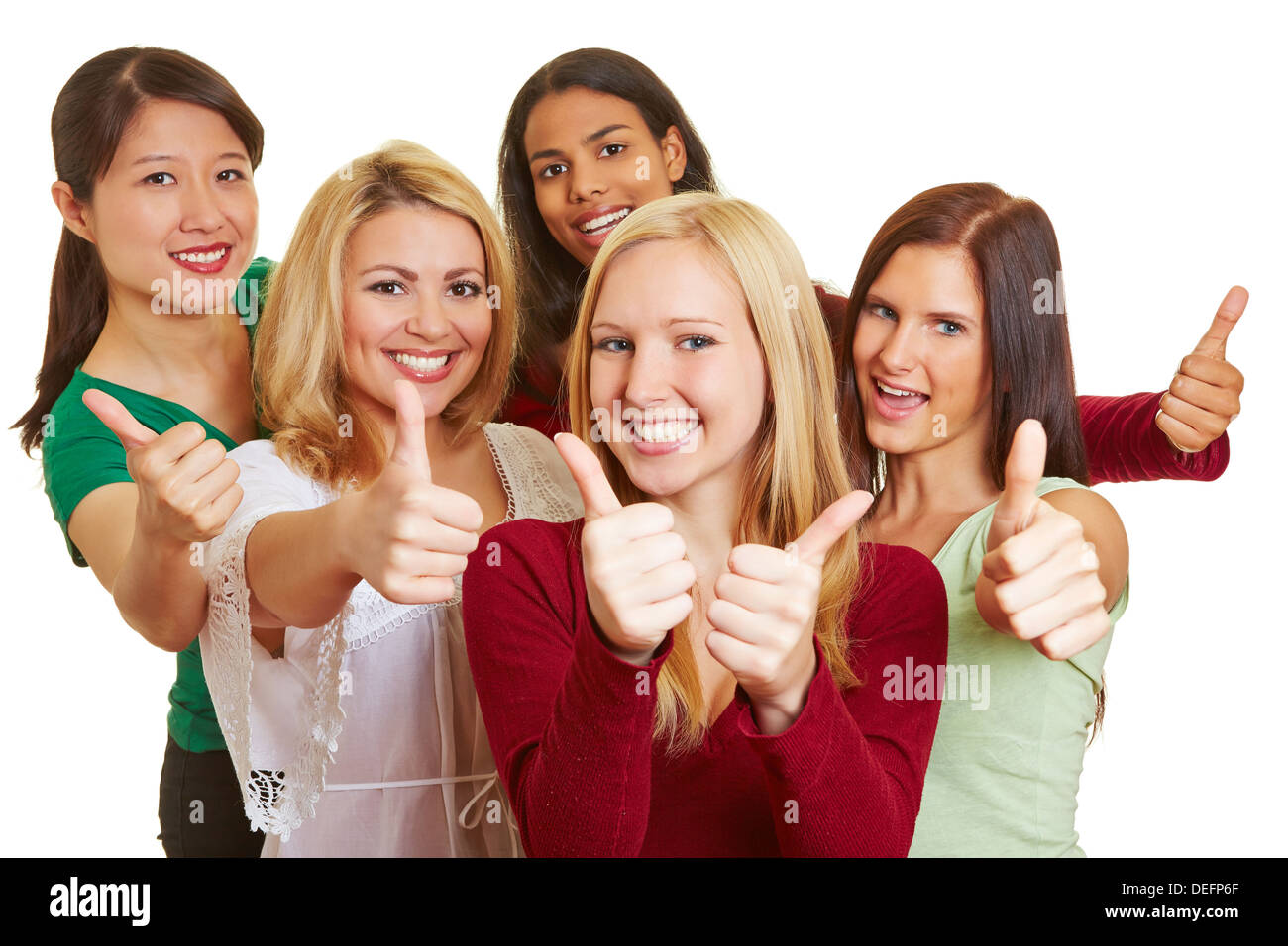 Felice giovane gruppo multirazziale delle donne tenendo i pollici fino Foto Stock