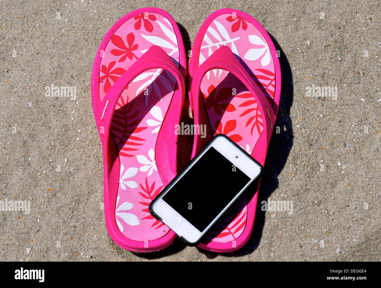 Il flip flop nella sabbia Foto Stock