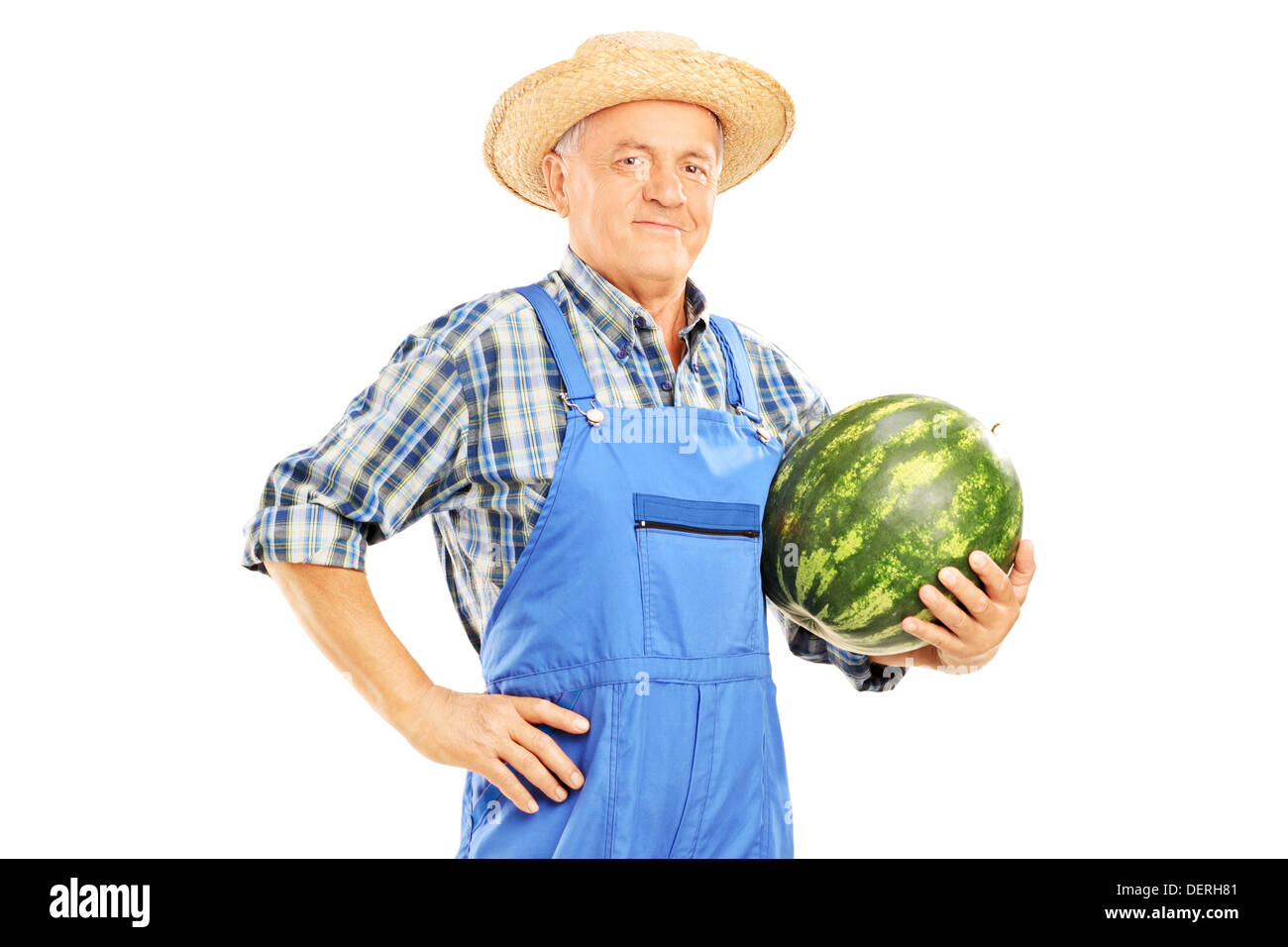 Sorridendo l'agricoltore che detiene un cocomero Foto Stock