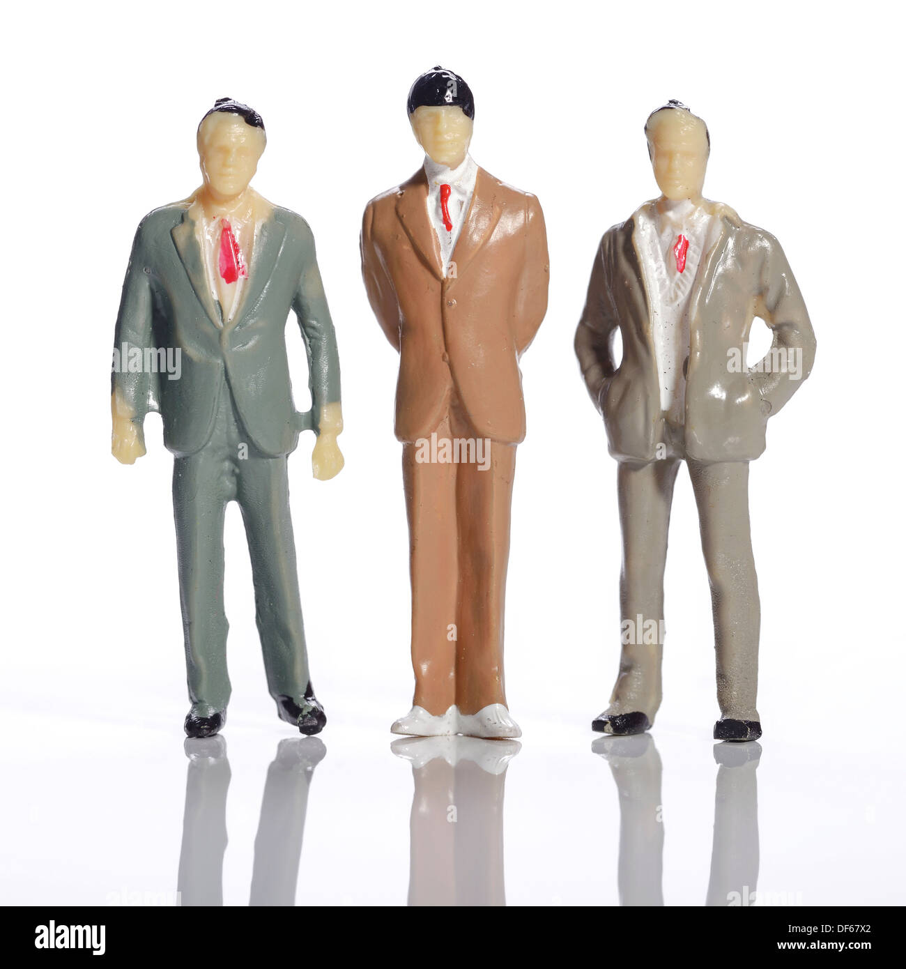 Tre mini in plastica uomini di affari Foto Stock