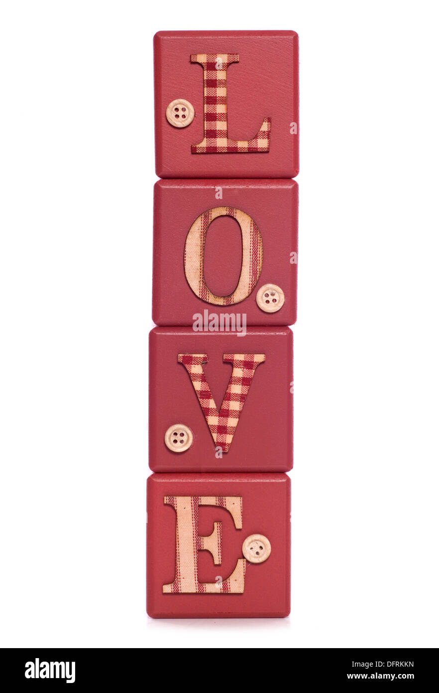 La parola amore in blocchi verticali intaglio Foto Stock