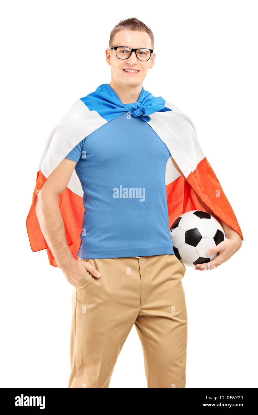 Young sport ventola con bandiera di Holland tenendo un pallone da calcio Foto Stock