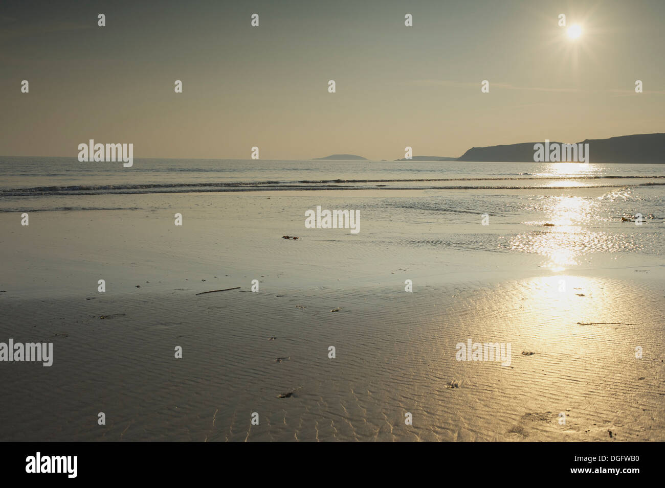 Porth Neigwl, il Galles del Nord scene: Tramonto su una marea Foto Stock