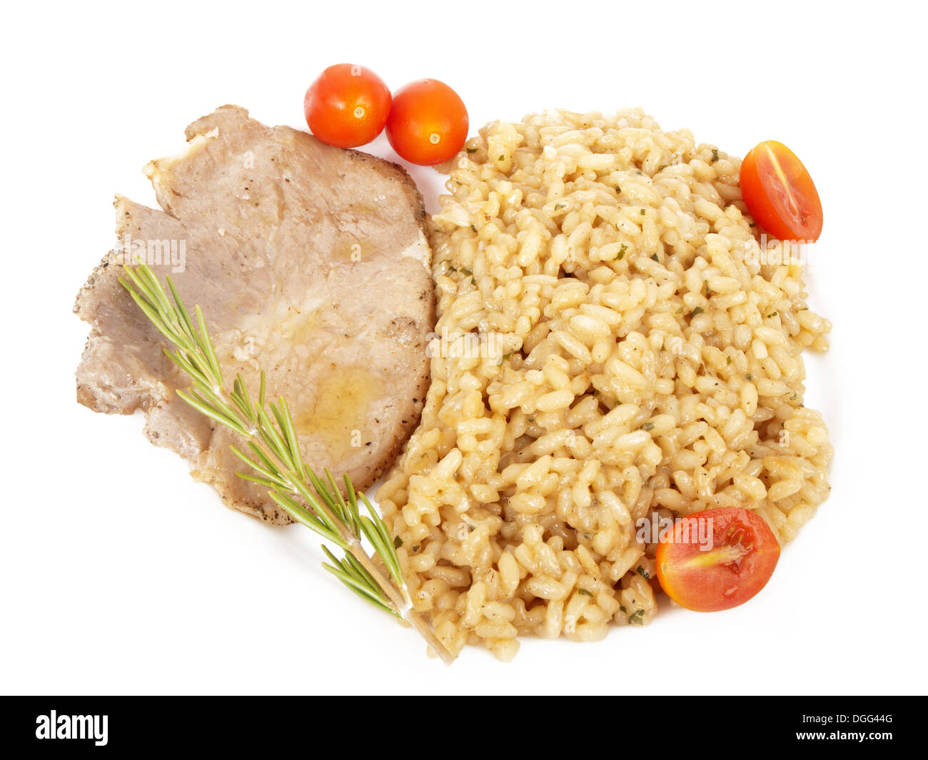 Risotto rosso, costolette di maiale, pomodoro e rosmarino Foto Stock