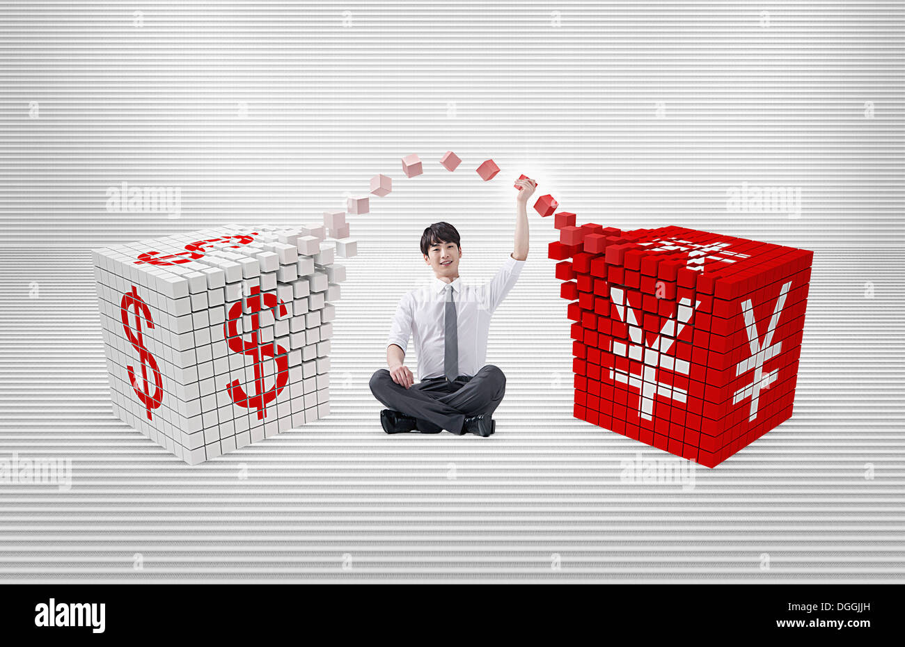 Un business uomo seduto tra i cubetti di valute Foto Stock