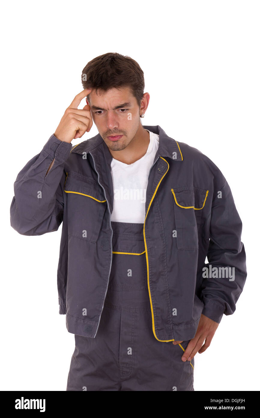 Lavoratore in uniforme di lavoro nel pensiero profondo Foto Stock