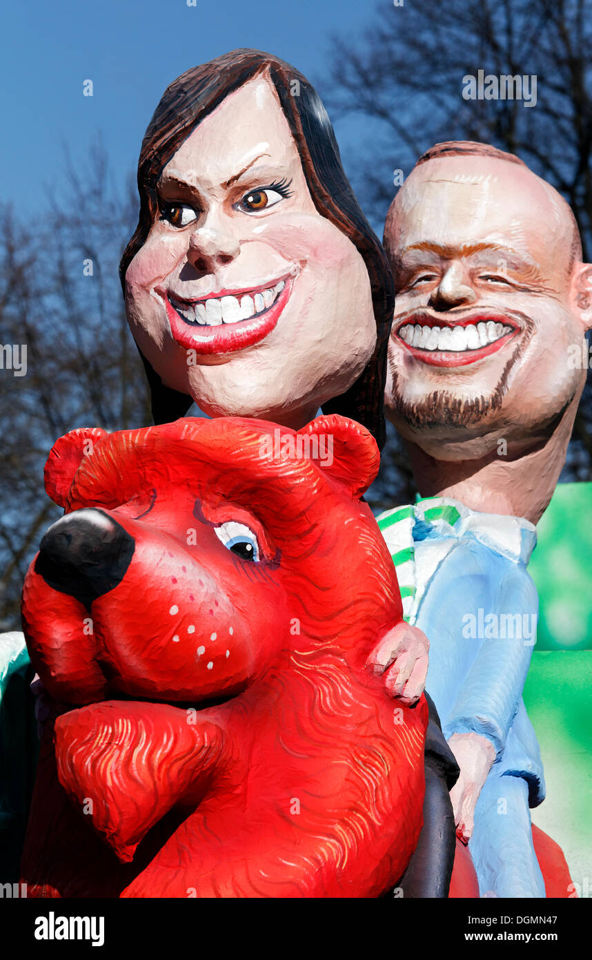 Lena Meyer-Landrut e Stefan Raab a cavallo su un Lion, carta-mache figure a tema di sfilata galleggiante sul Carnevale Rosenmontagszug Foto Stock